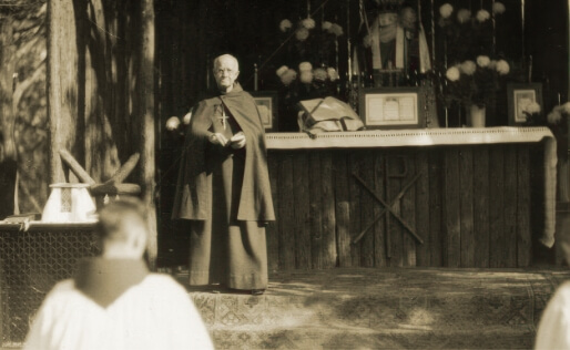 Historical Photo of Fr. Paul Watson Performing an 0utdoor Mass